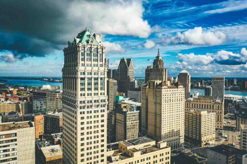 Detroit skyline with historic buildings under dramatic clouds